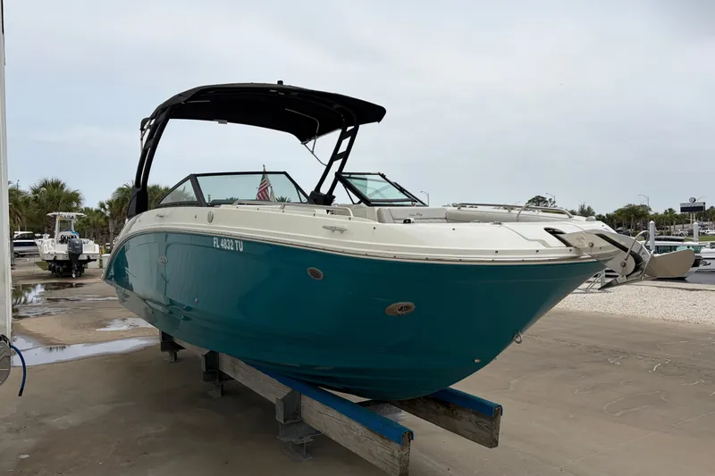 Slide: The Image of 2024 Sea Ray SDX 270 Outboard boat on display, featuring sleek design and vibrant blue hull. - 3