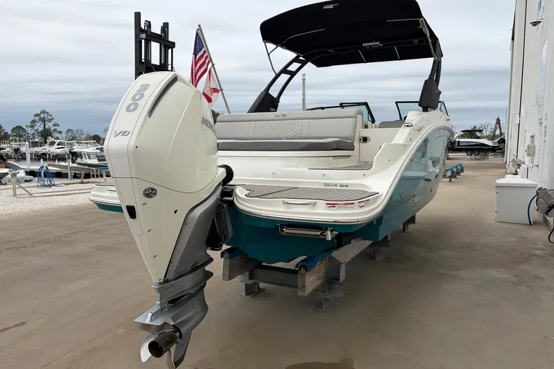 Slide: The Image of 2024 Sea Ray SDX 270 Outboard boat with powerful engine, docked outdoors. - 4