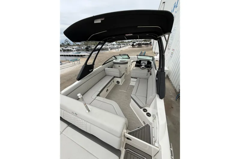 Slide: The Image of 2024 Sea Ray SDX 270 Outboard boat interior with spacious seating and sleek design. - 6