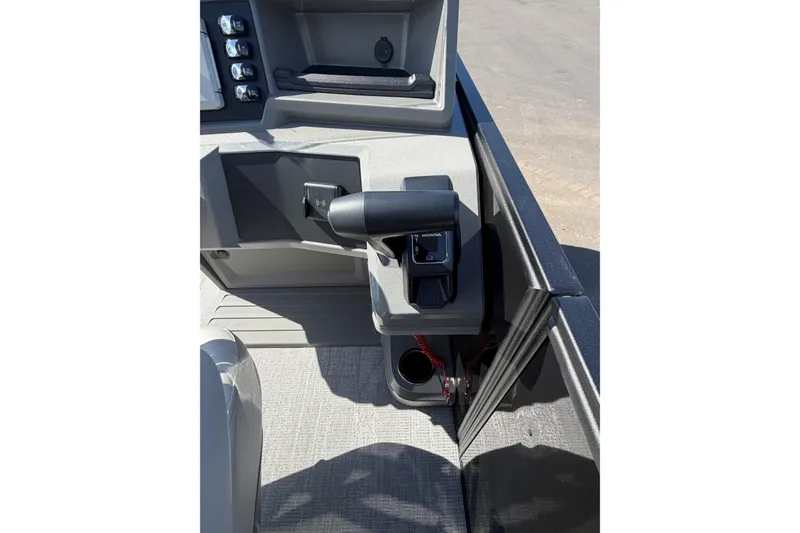 Slide: The Image of Control panel of 2026 Whisper D21 XRE CRUISE boat with throttle lever and switches. - 10