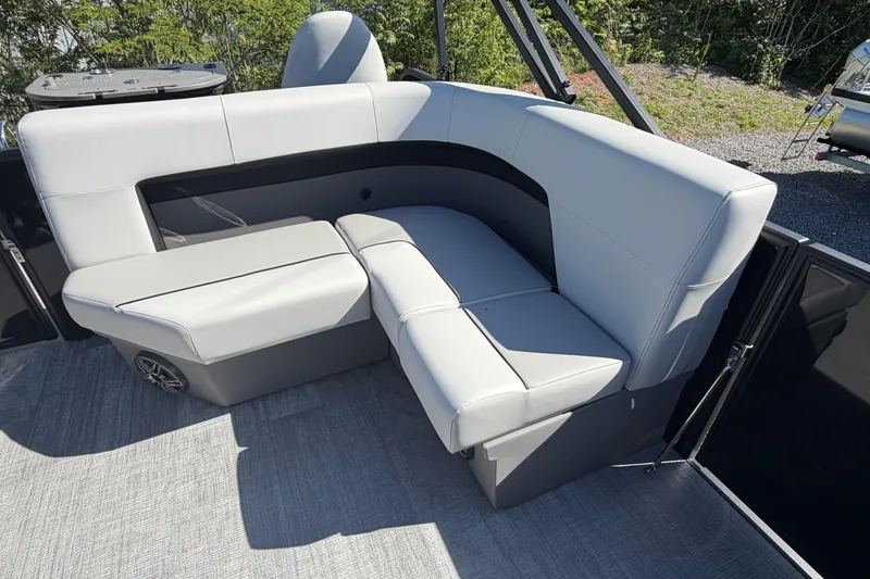 Slide: The Image of Luxurious seating on the 2026 Whisper D21 XRE CRUISE boat, featuring sleek gray upholstery. - 13