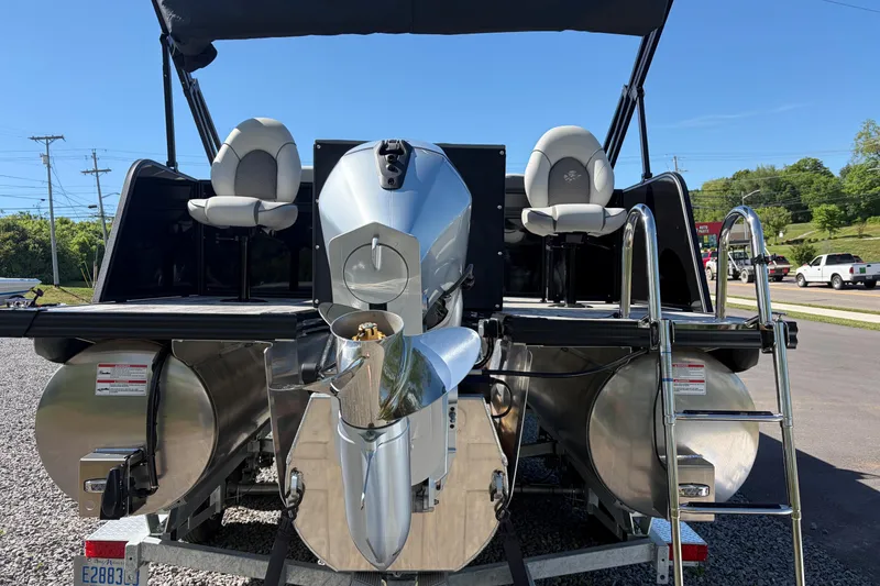 Slide: The Image of 2026 Whisper D21 XRE CRUISE boat with dual seats and powerful engine, parked outdoors. - 14