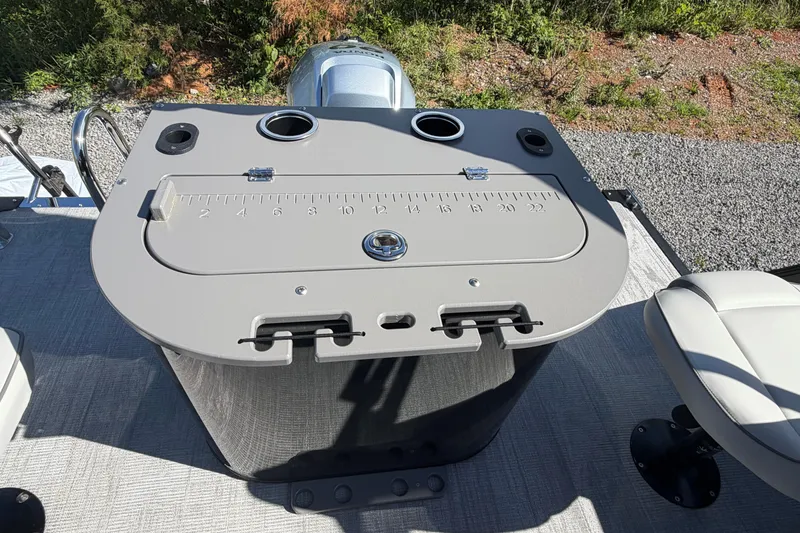 Slide: The Image of Fishing station on a 2026 Whisper D21 XRE CRUISE boat with measuring scale and cup holders. - 15