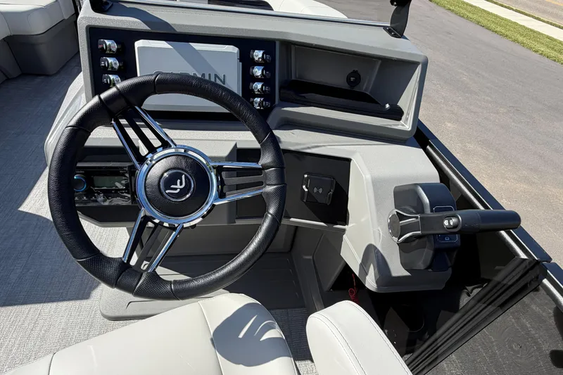Slide: The Image of Steering console of 2026 Whisper D21 XRE CRUISE boat with modern controls. - 9
