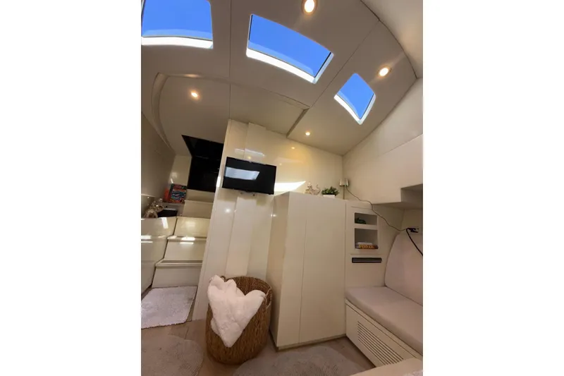 Slide: The Image of Luxurious interior of a 2015 CNM Continental yacht with skylights and modern furnishings. - 16