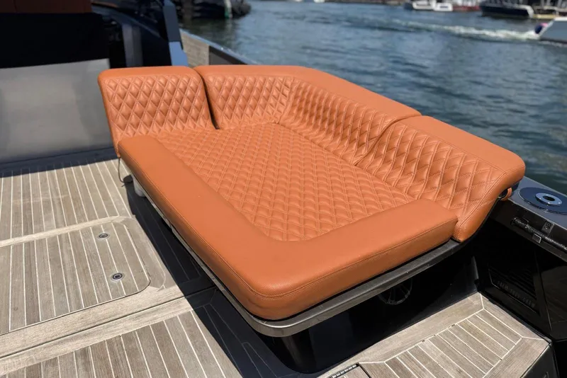 Slide: The Image of Luxurious tan leather seating on a 2015 CNM Continental yacht deck. - 20