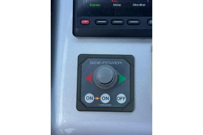 Slide: The Image of Control panel of a 2015 CNM Continental boat with side-power thruster switch. - 21