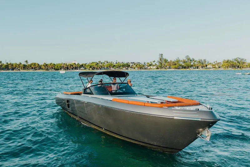 Slide: The Image of Luxury CNM Continental 2015 yacht cruising on blue waters near a tropical shoreline. - 25