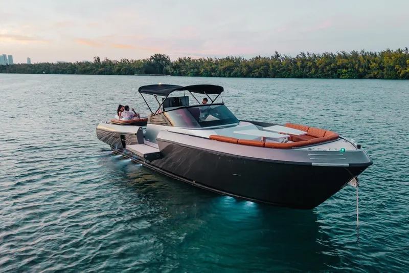 Slide: The Image of Luxurious 2015 CNM Continental yacht cruising on serene waters at sunset. - 28
