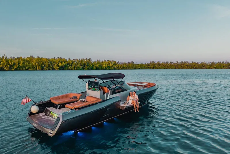 Slide: The Image of Luxury CNM Continental yacht on serene water, 2015 model, with passengers enjoying the view. - 29