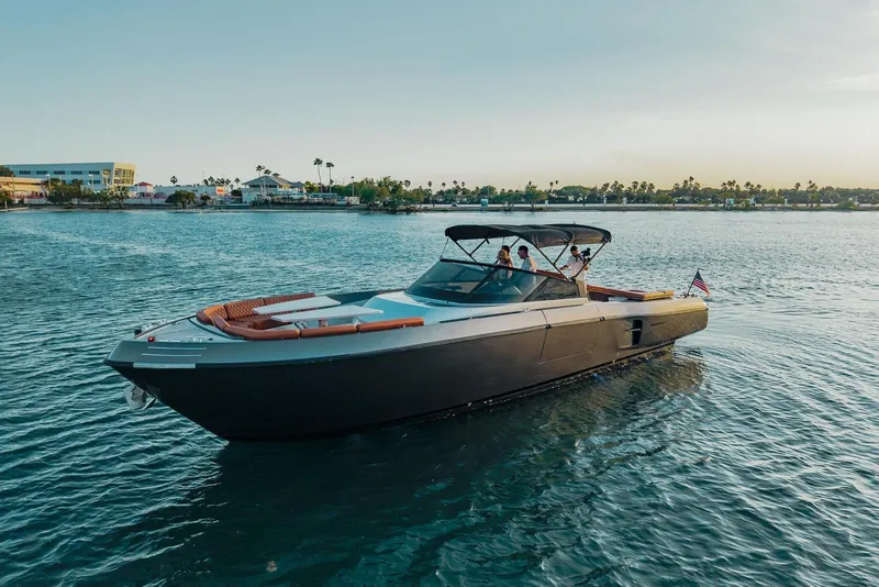 Slide: The Image of Luxury CNM Continental 2015 yacht cruising on serene waters at sunset. - 31