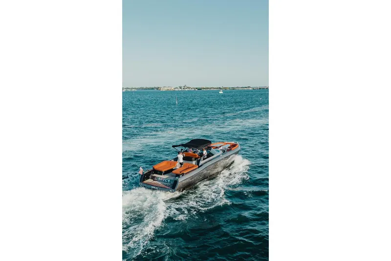 Slide: The Image of Luxury CNM Continental 2015 yacht cruising on open blue water. - 34
