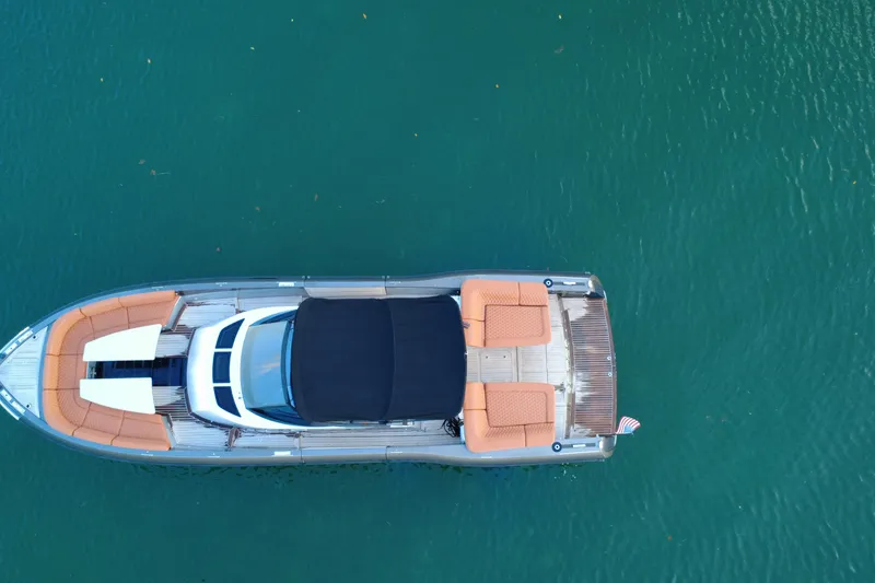 Slide: The Image of Aerial view of 2015 CNM Continental boat on turquoise water. - 4