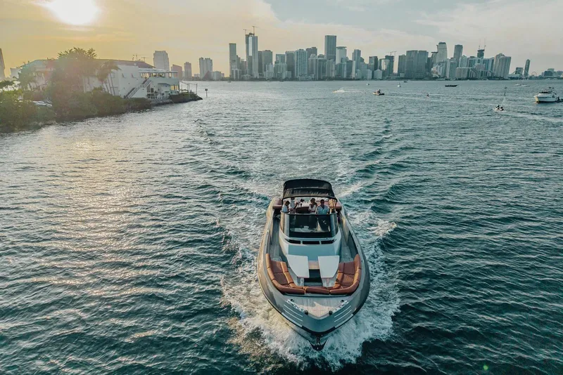 Slide: The Image of Luxury CNM Continental yacht cruising near city skyline at sunset, 2015 model. - 47