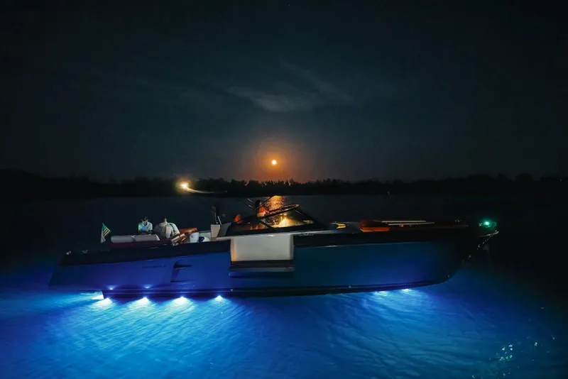Slide: The Image of Luxury CNM Continental yacht illuminated at night with moonlit sky, 2015 model. - 48