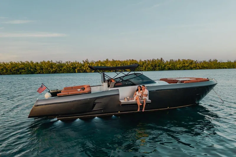 Slide: The Image of Couple relaxing on a 2015 CNM Continental yacht in serene waters. - 51