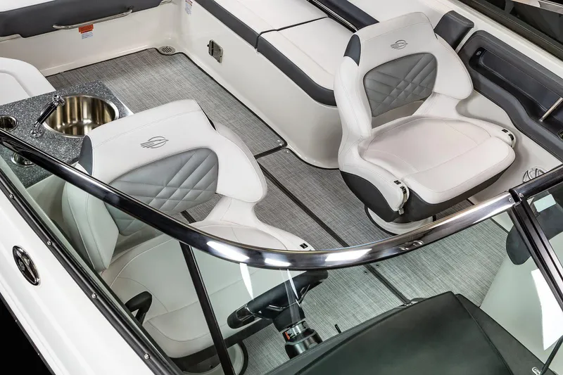 Slide: The Image of Manufacturer Provided Image: 2021 Chaparral 307 SSX boat interior with white and gray seating. - 11