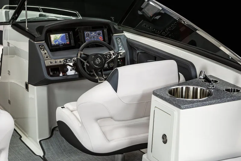 Slide: The Image of Manufacturer Provided Image: 2021 Chaparral 307 SSX boat cockpit with modern controls and luxurious seating. - 13