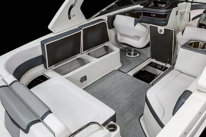 Slide: The Image of Manufacturer Provided Image: 2021 Chaparral 307 SSX boat interior with open storage compartments and seating. - 15