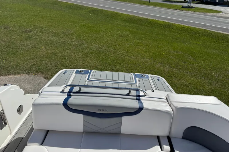 Slide: The Image of 2021 Chaparral 307 SSX boat interior with sleek seating and modern design. - 2
