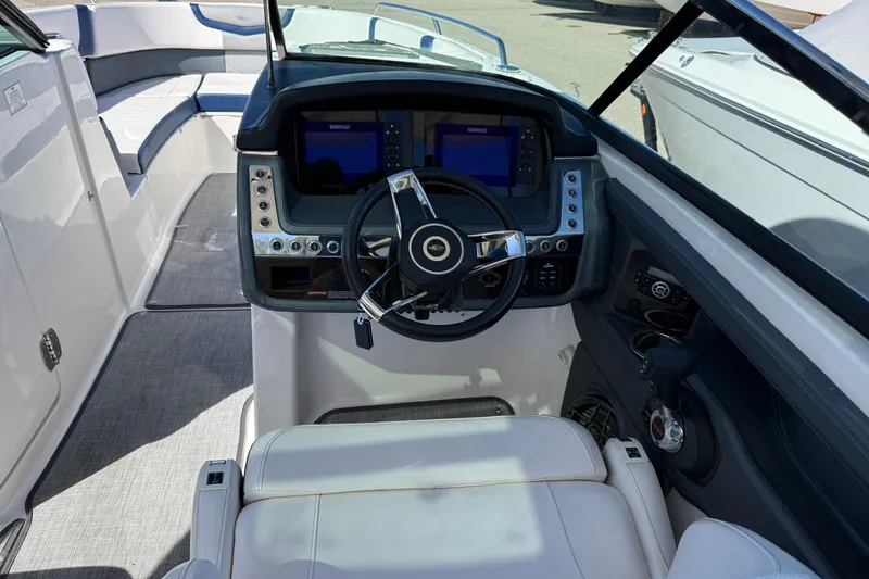 Slide: The Image of Cockpit of 2021 Chaparral 307 SSX boat with modern steering and controls. - 3