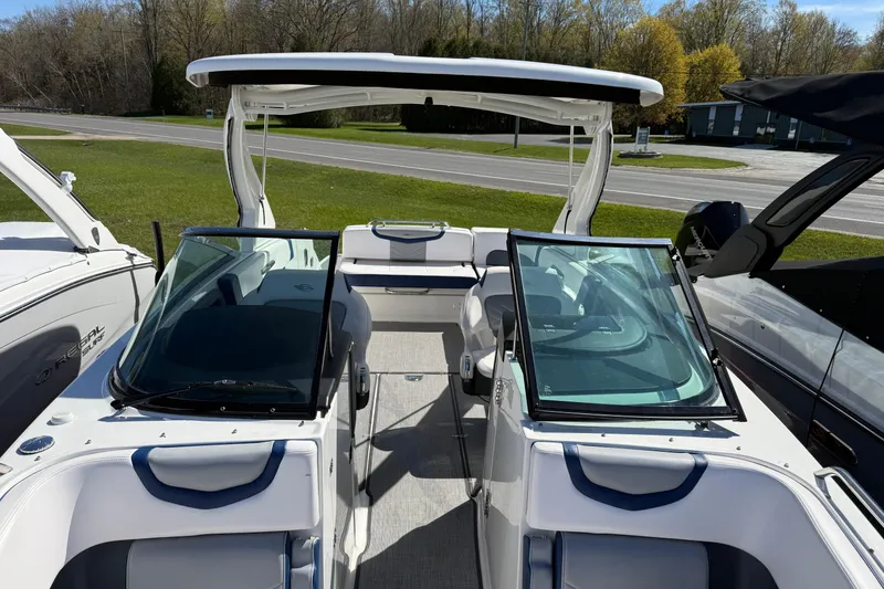 Slide: The Image of 2021 Chaparral 307 SSX boat with sleek design and spacious seating on display. - 5