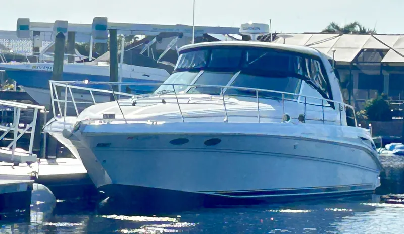 Slide: The Image of 2003 Sea Ray 410 Express Cruiser docked at marina. - 10