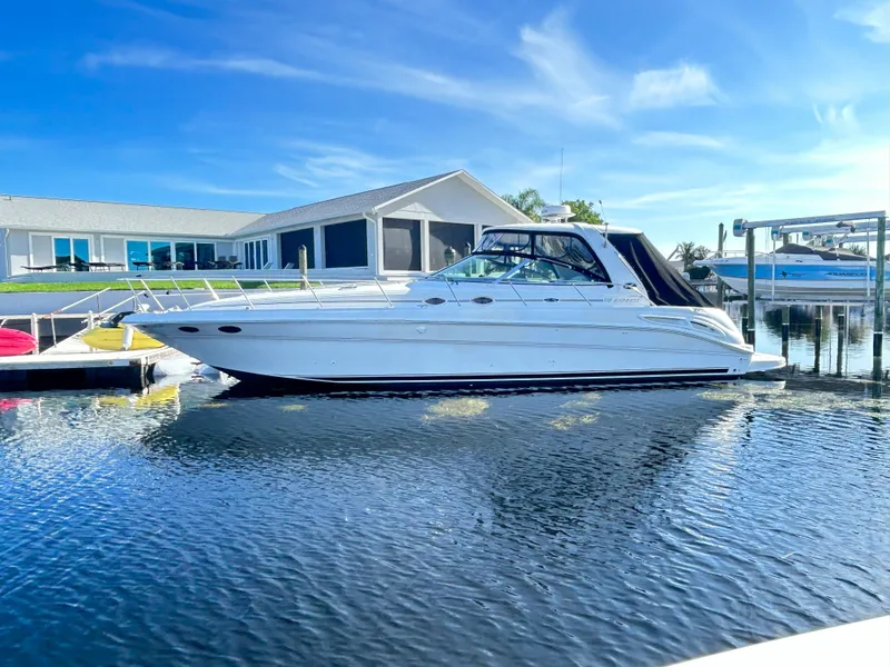 Slide: The Image of 2003 Sea Ray 410 Express Cruiser docked on a sunny day. - 11