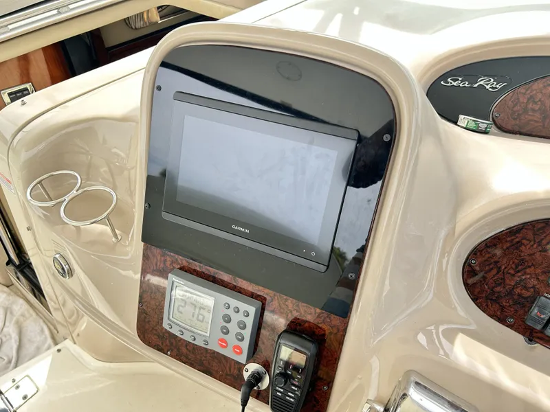 Slide: The Image of Dashboard of 2003 Sea Ray 410 Express Cruiser with Garmin display. - 14