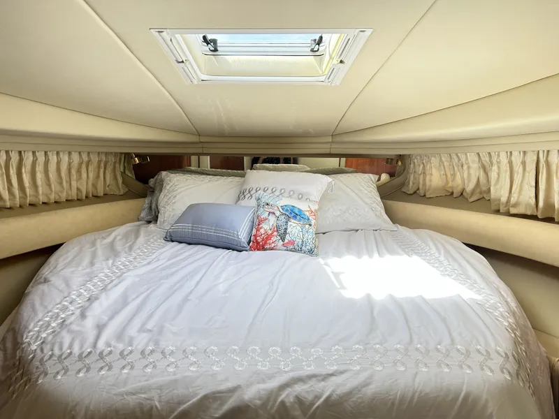 Slide: The Image of Interior of 2003 Sea Ray 410 Express Cruiser with cozy bed. - 20