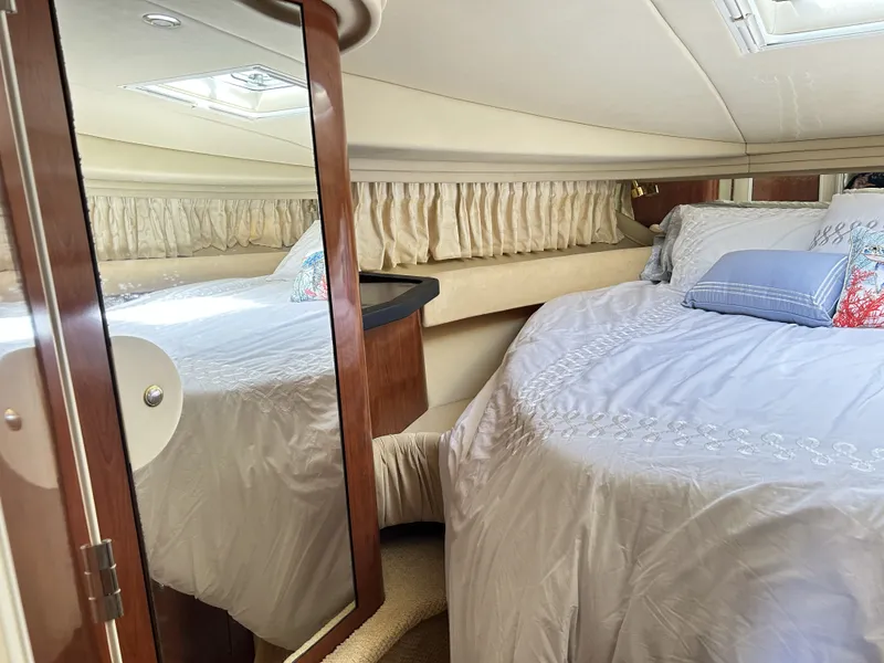 Slide: The Image of Interior of 2003 Sea Ray 410 Express Cruiser with cozy bedroom. - 21