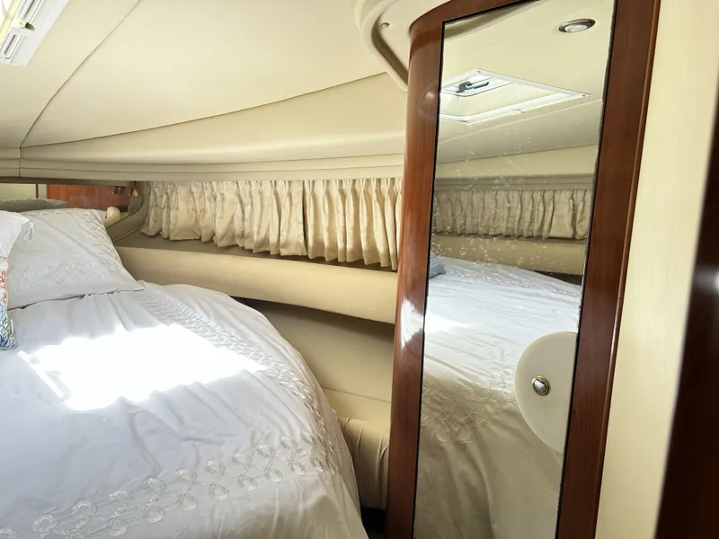 Slide: The Image of Interior of 2003 Sea Ray 410 Express Cruiser with bed and mirror. - 22