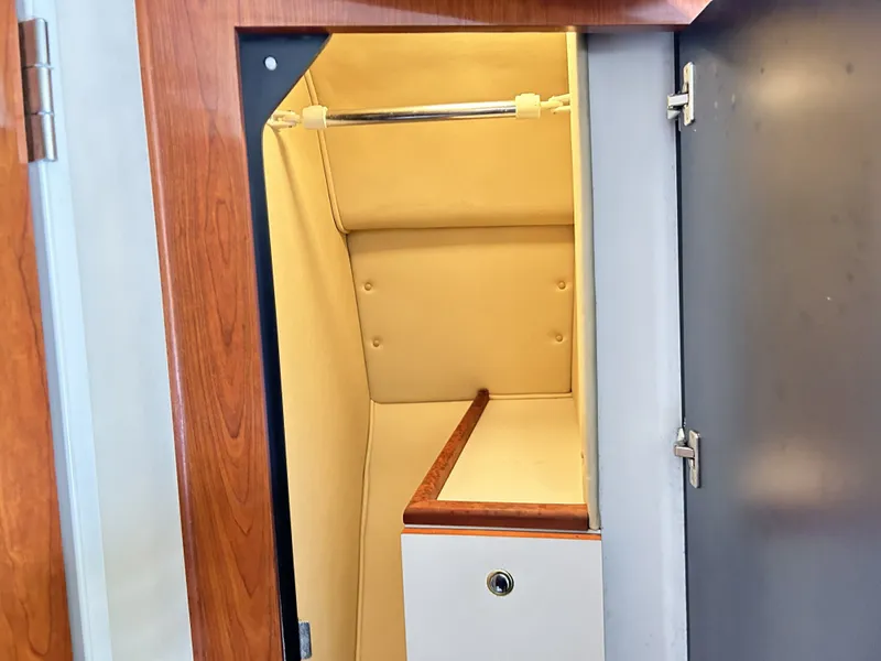 Slide: The Image of Interior of a 2003 Sea Ray 410 Express Cruiser closet. - 23