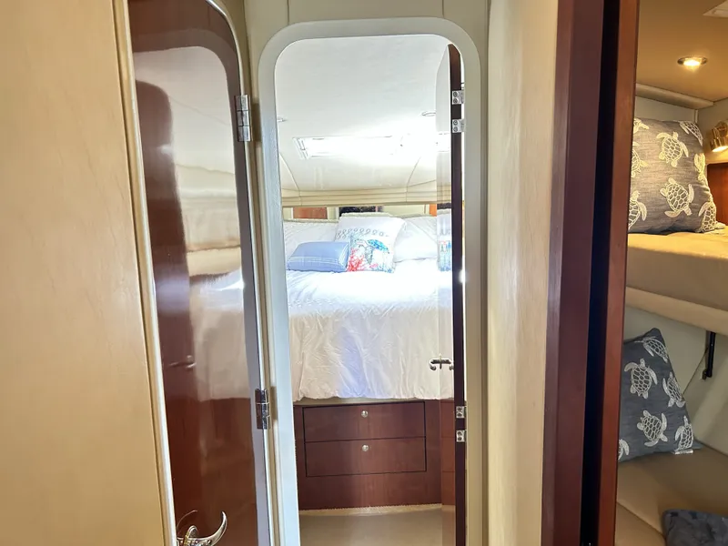 Slide: The Image of Interior of 2003 Sea Ray 410 Express Cruiser, bedroom view. - 25