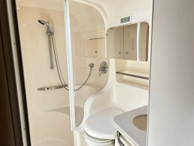 Slide: The Image of Bathroom of 2003 Sea Ray 410 Express Cruiser with shower and mirror. - 26