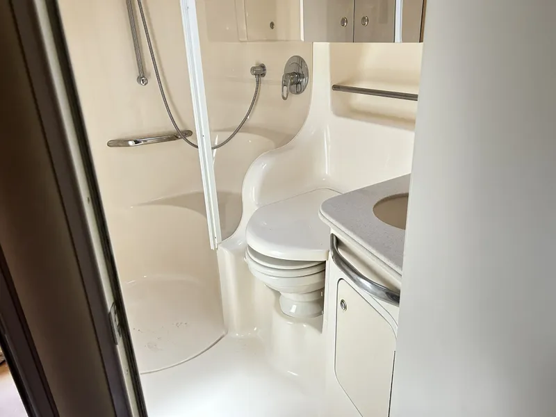 Slide: The Image of Bathroom of 2003 Sea Ray 410 Express Cruiser, compact and functional. - 27