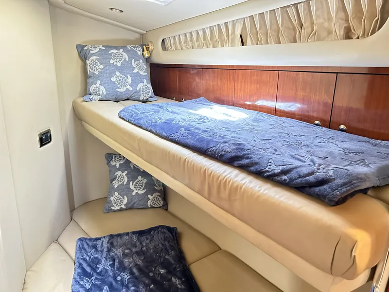 Slide: The Image of Interior of 2003 Sea Ray 410 Express Cruiser with cozy bed. - 31