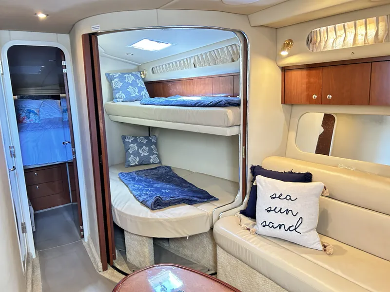 Slide: The Image of Interior of 2003 Sea Ray 410 Express Cruiser with bunk beds. - 34