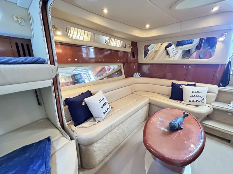 Slide: The Image of Interior of 2003 Sea Ray 410 Express Cruiser with elegant leather seating. - 36