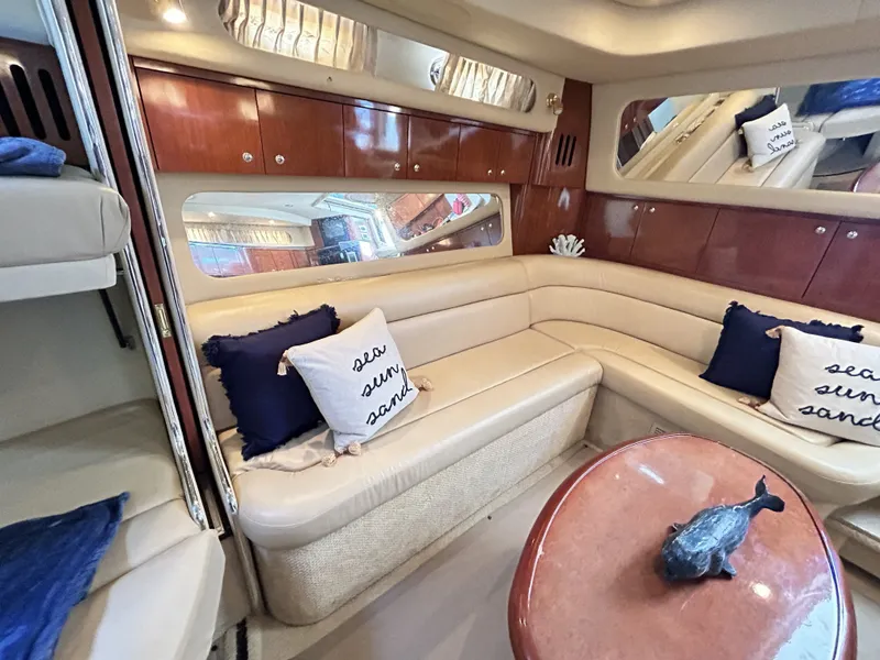 Slide: The Image of Interior of 2003 Sea Ray 410 Express Cruiser with leather sofa and cushions. - 37