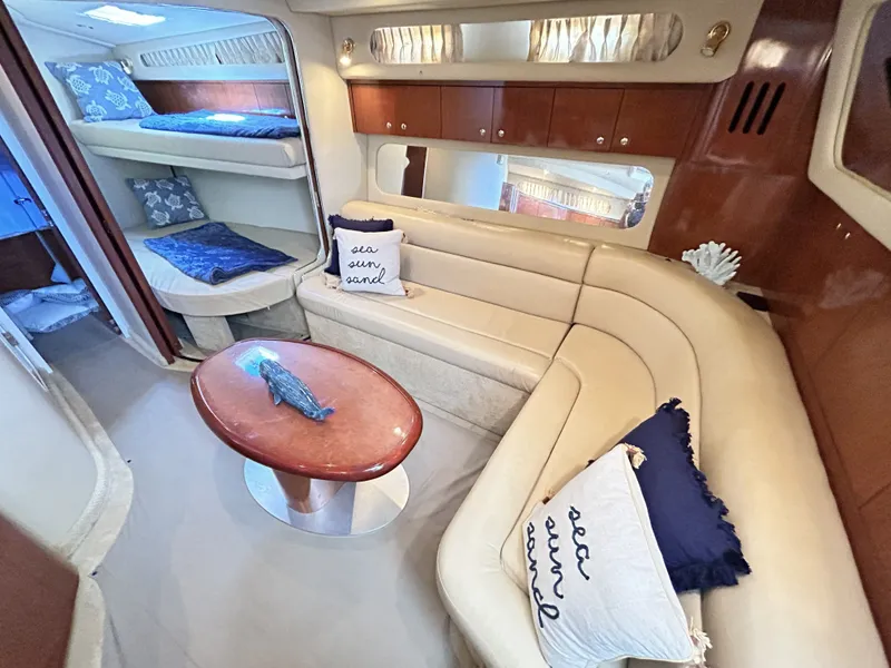 Slide: The Image of Interior of 2003 Sea Ray 410 Express Cruiser with cozy seating area. - 38