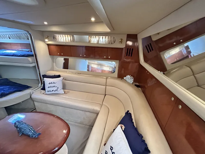 Slide: The Image of Interior of 2003 Sea Ray 410 Express Cruiser with elegant leather seating. - 39