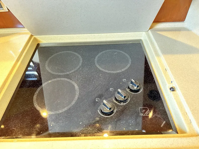 Slide: The Image of Stovetop in 2003 Sea Ray 410 Express Cruiser. - 43