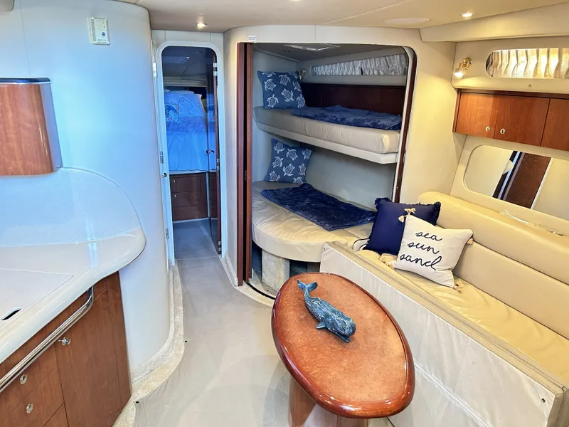 Slide: The Image of Interior of 2003 Sea Ray 410 Express Cruiser with cozy seating area. - 46