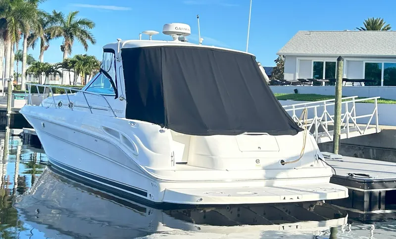 Slide: The Image of 2003 Sea Ray 410 Express Cruiser at dock, sunny day. - 6