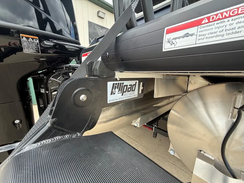 Slide: The Image of Viaggio Lago V 20C 2026 boat with Revo ladder and warning labels. - 13