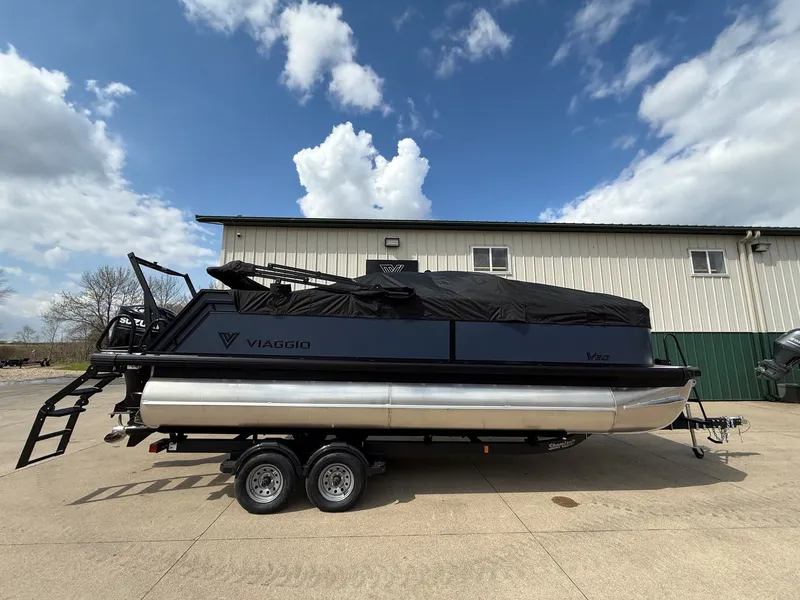 Slide: The Image of Viaggio Lago V 20C 2026 pontoon boat on trailer, blue sky. - 31