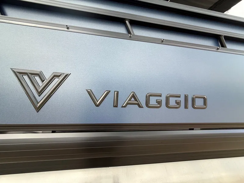 Slide: The Image of Viaggio Lago V 20C 2026 logo on metallic surface. - 4