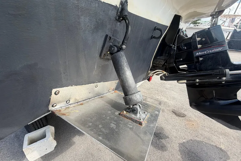 Slide: The Image of 2004 Bayliner 2452 Ciera Express boat with MerCruiser engine and trim tab detail. - 7