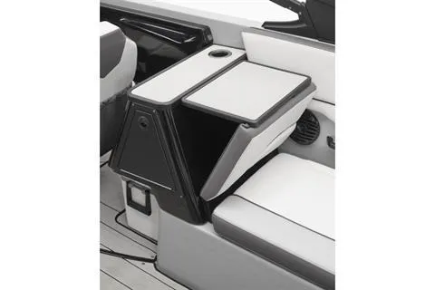 Slide: The Image of 2026 Yamaha 252XE boat interior with foldable seating and cup holder. - 6